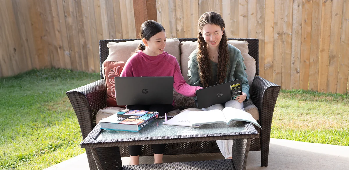 girls studying and smiling